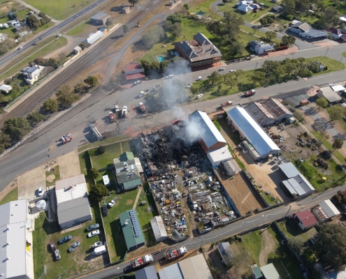 PGC Aerial drone image showing smoke and fire damage at The Rock, NSW.